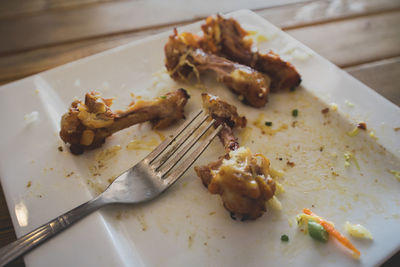 High angle view of meat in plate on table