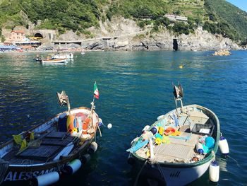 Boats moored on sea