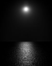 Scenic view of sea against sky at night