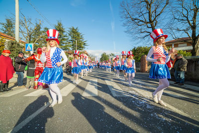 Full length of people walking on road