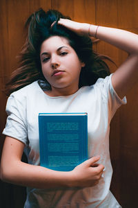 Portrait of young woman using mobile phone