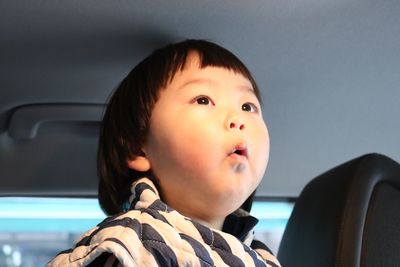 Close-up of boy in car