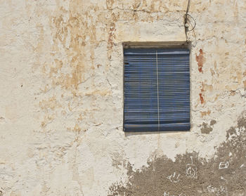 Low angle view of window on building wall