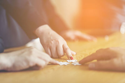 Close-up of woman hand on table