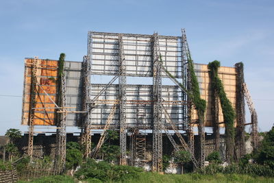 Low angle view of construction site against sky