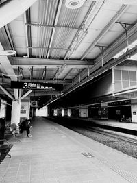 People waiting at railroad station platform