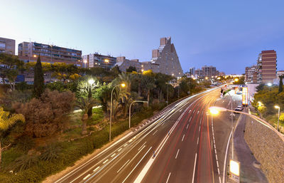 High angle view of light trails on road in city