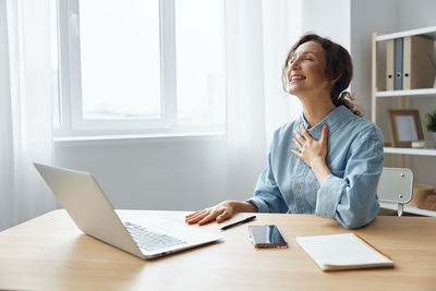 Businesswoman working at desk in office