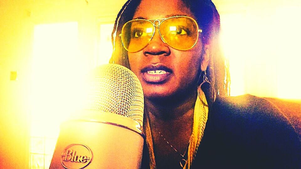 Radio Talk Show woman microphone yellow shades locs beight natural light Young Adult Indoors  Lifestyles Beauty Casual Clothing Enjoying Life