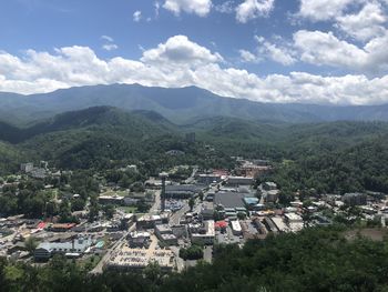 High angle view of townscape and mountains against sky