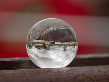 Close-up of crystal ball on table at playground