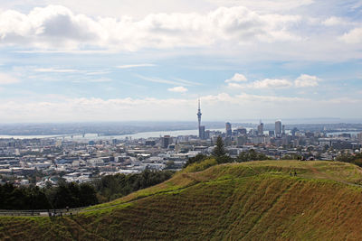 High angle view of cityscape against cloudy sky