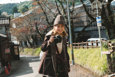 Portrait of smiling women holding camera