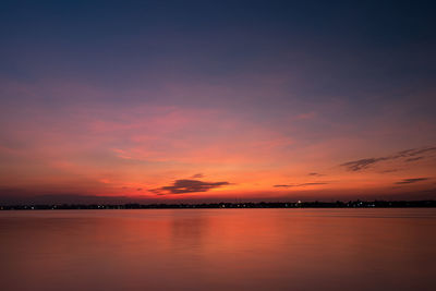 Scenic view of sea against romantic sky at sunset