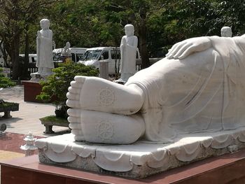 Sculpture of buddha statue against built structure