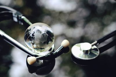 Close-up of crystal ball on metal