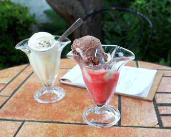 Two glasses with ice cream on a table 