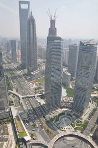 Aerial view of cityscape against sky