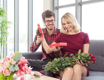 Young couple holding bouquet