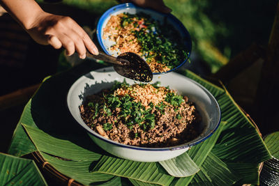 High angle view of person preparing food on table