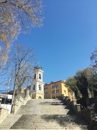 Low angle view of built structure against clear blue sky