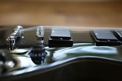 High angle view of guitar on table