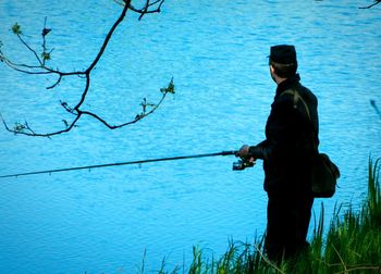 Man fishing in lake