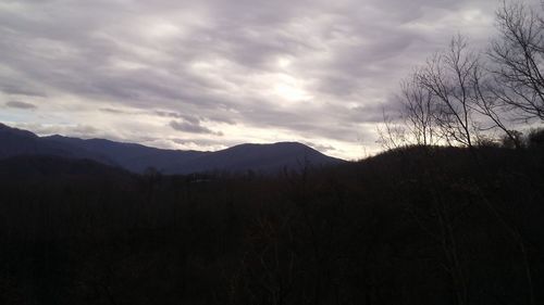 Scenic view of silhouette mountains against sky