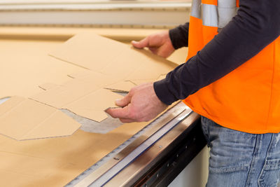 Midsection of man working