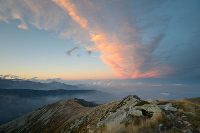 Scenic view of mountains against sky during sunset