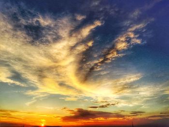 Low angle view of cloudy sky at sunset