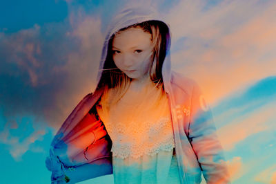 Double exposure of girl and sky