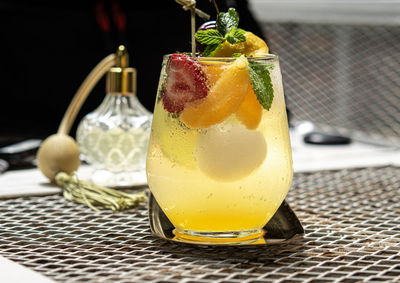 Fresh summer soft drink lady mocktail pour in glass decoration with fruit