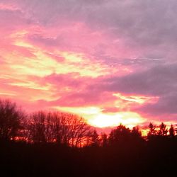 Scenic view of dramatic sky at sunset