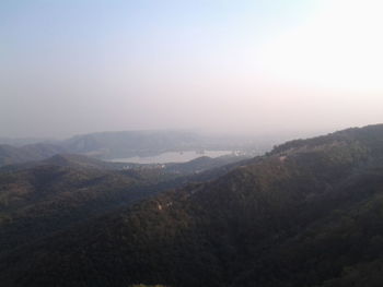 Scenic view of mountains in foggy weather