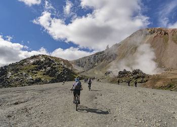 People riding bicycle on mountain