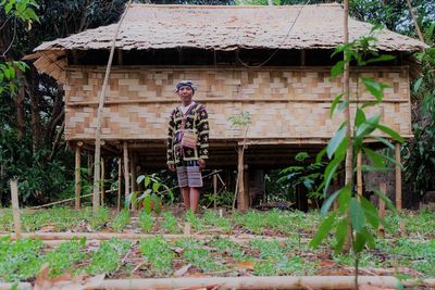 Man standing outside house