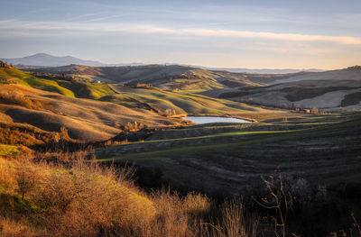 Scenic view of landscape against sky during sunset