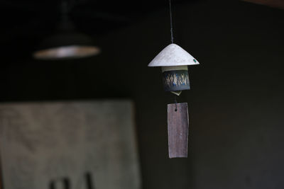 Close-up of pendant light hanging on wall