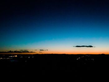 Scenic view of silhouette landscape against clear sky at night