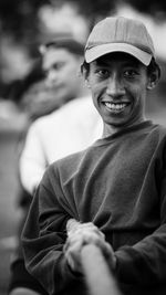 Portrait of smiling man pulling rope