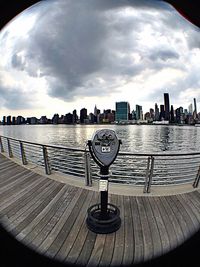 Cityscape against cloudy sky