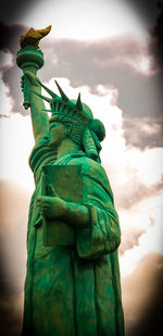 Low angle view of statue against cloudy sky