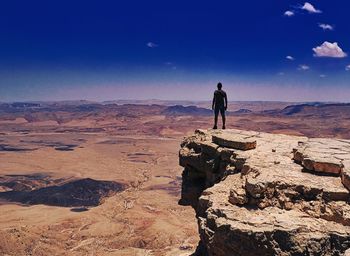 Full length of man on rock against sky