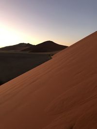 Scenic view of desert against clear sky