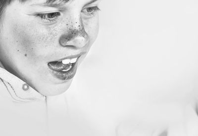 Close-up of boy with freckle on face