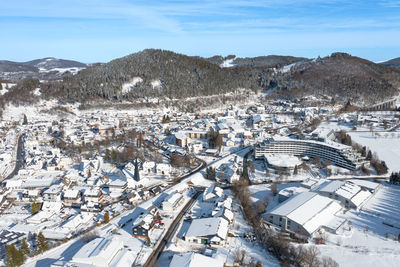 Aerial view of willingen upland. hotels and restaurants,  surrounded by mountains.