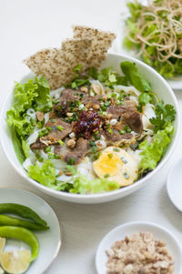 Vietnamese noodle - my quang, vietnamese traditional cuisine, noodles in bowl on the table 