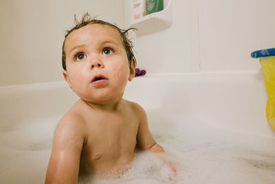 Close up of baby in bath tub