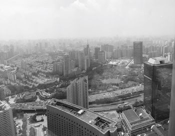 Aerial view of cityscape against sky